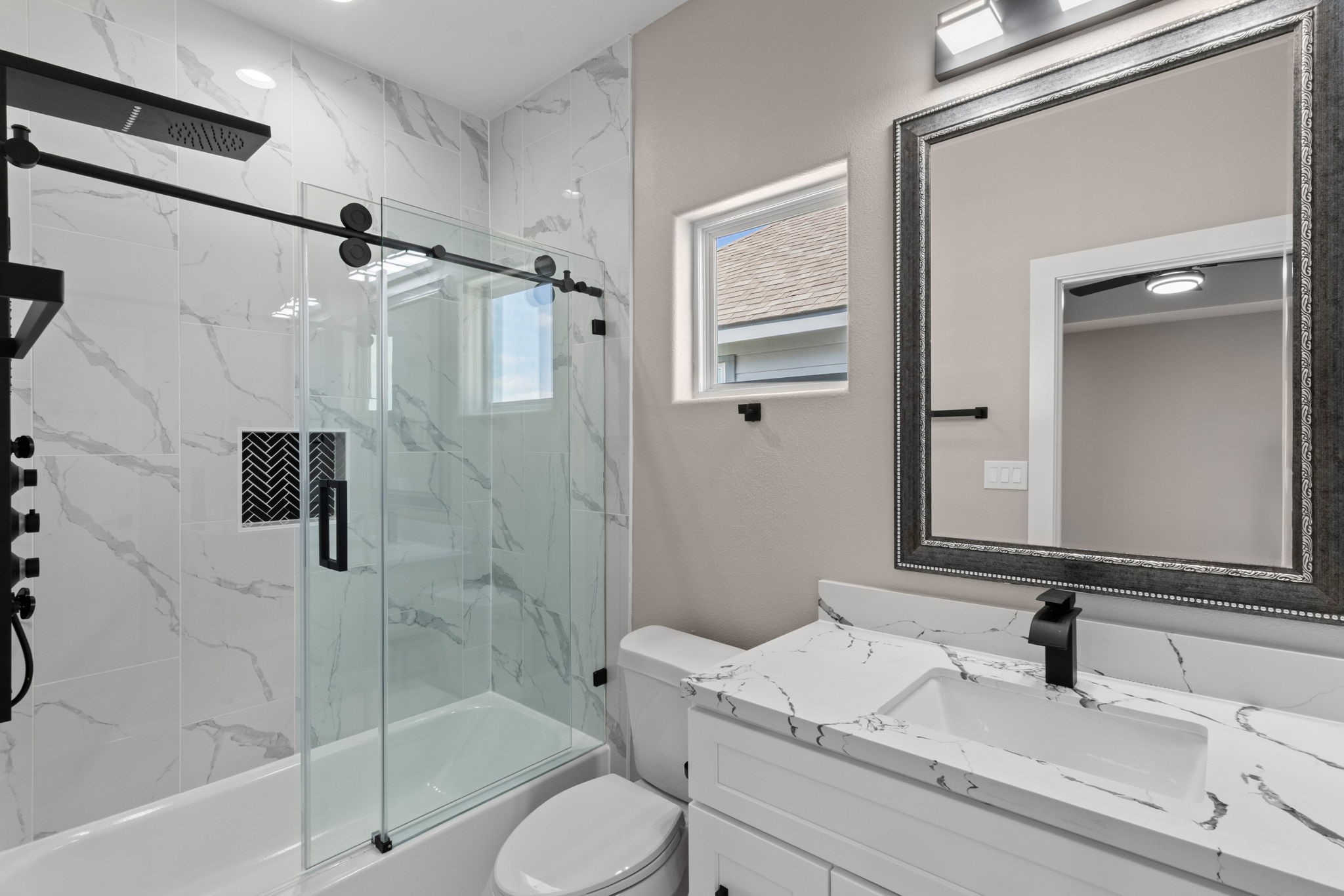 7925 Colonial Lane Houston, TX 77051 - Photo 18 of 31 a bathroom with a granite countertop sink toilet and shower