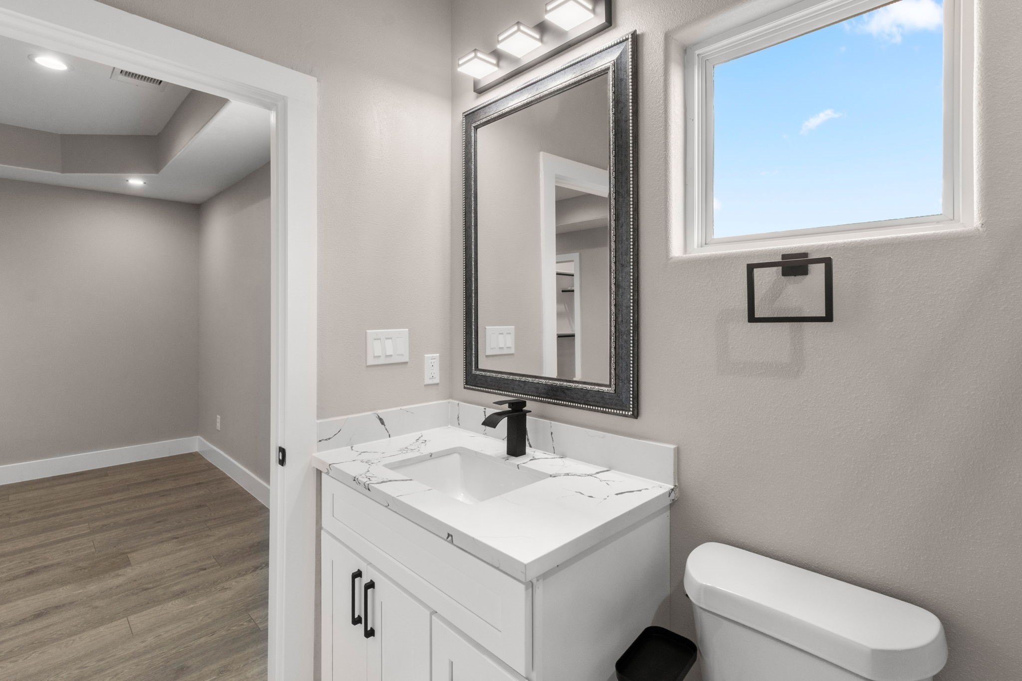 7925 Colonial Lane Houston, TX 77051 - Photo 20 of 31 a bathroom with a toilet a sink a vanity and mirror