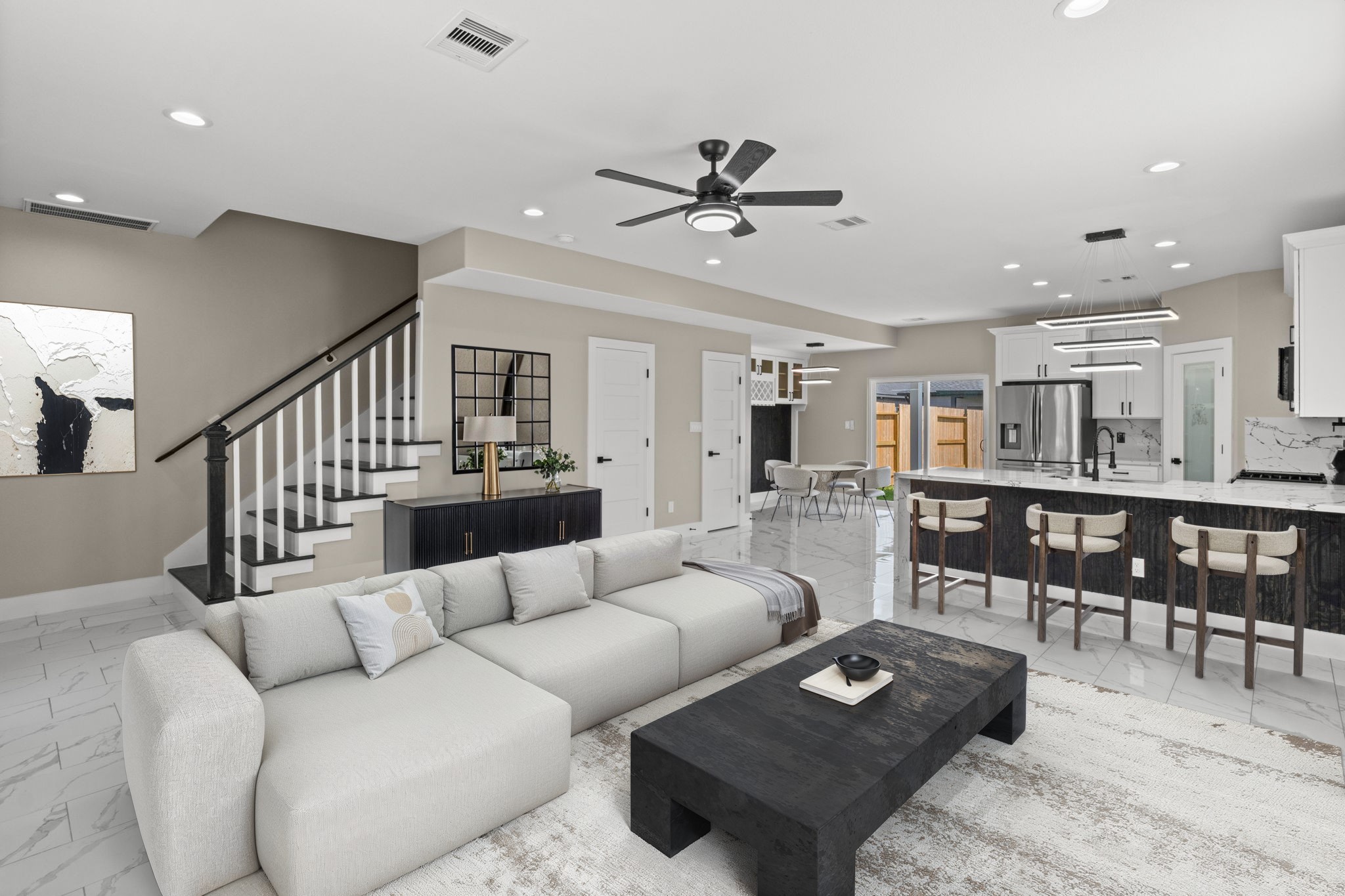 7925 Colonial Lane Houston, TX 77051 - Photo 2 of 31 a living room with furniture and a dining table with wooden floor