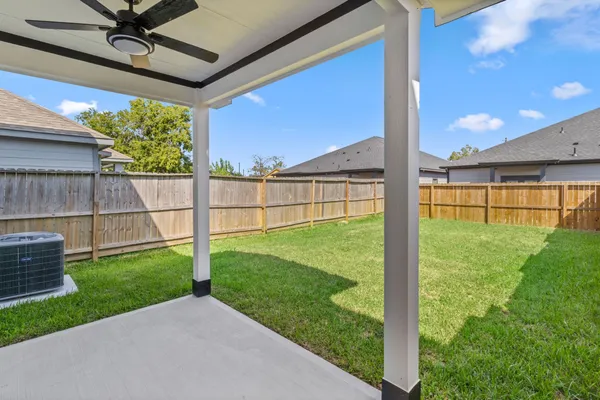 a view of a backyard with a garden and plants