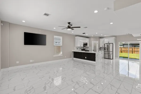 a view of a kitchen with a sink and a microwave