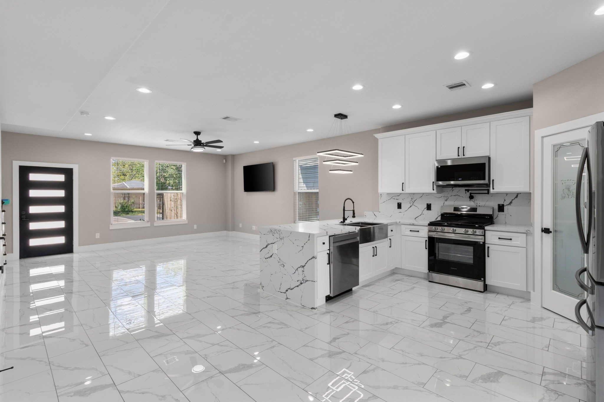 7925 Colonial Lane Houston, TX 77051 - Photo 6 of 31 a large kitchen with stainless steel appliances granite countertop a stove and a sink