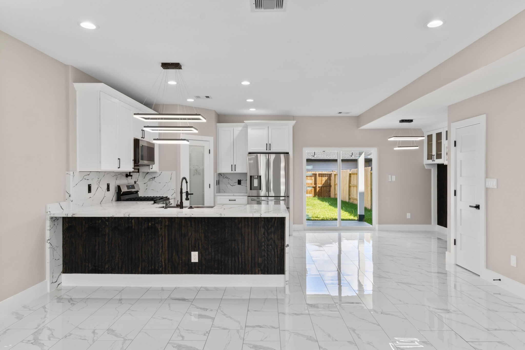 7925 Colonial Lane Houston, TX 77051 - Photo 7 of 31 a view of kitchen with stainless steel appliances granite countertop a refrigerator and a sink