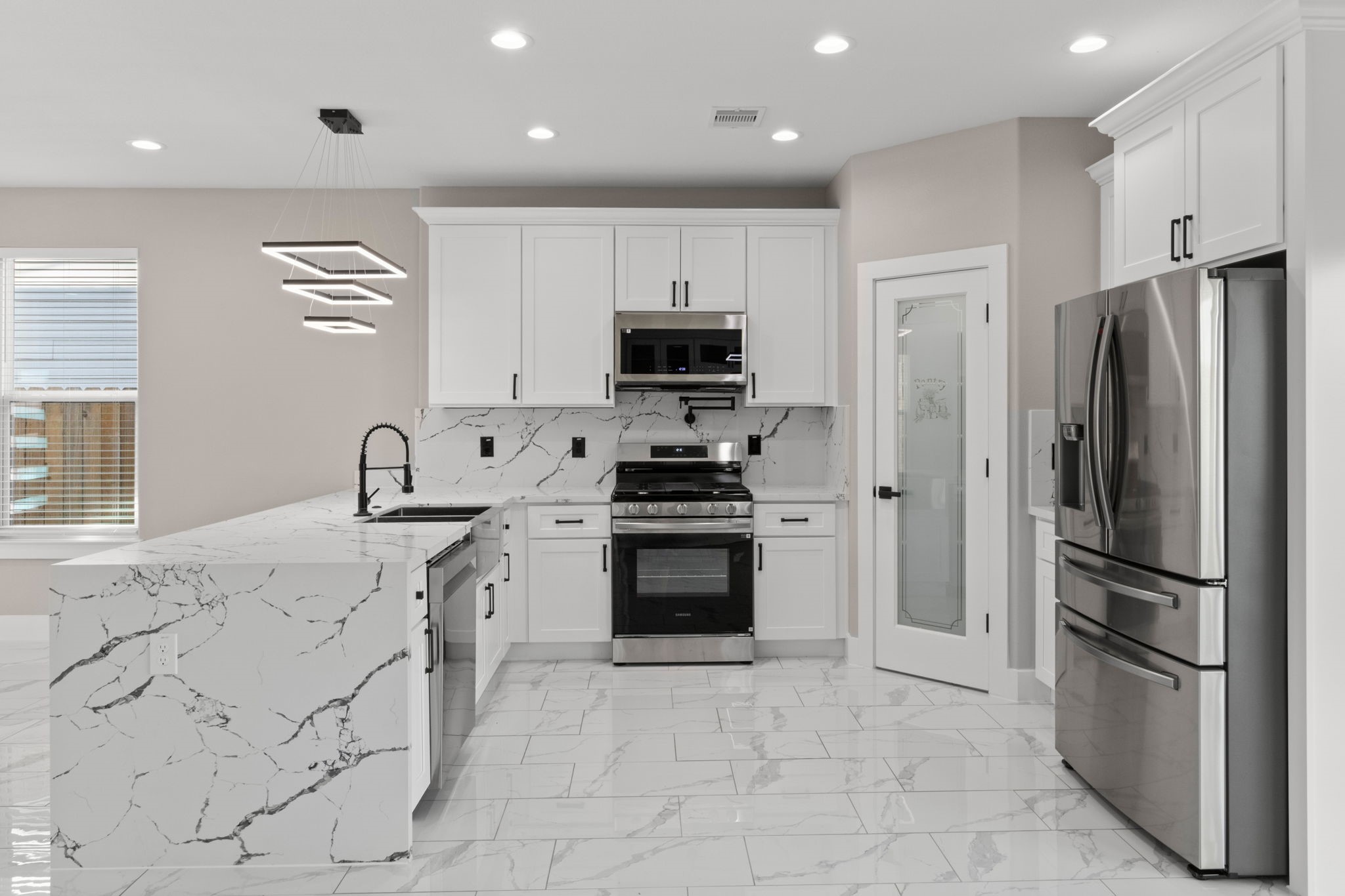 7925 Colonial Lane Houston, TX 77051 - Photo 9 of 31 a kitchen with stainless steel appliances granite countertop a refrigerator and a stove top oven