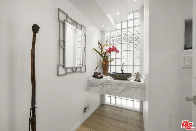 a view of a hallway with windows