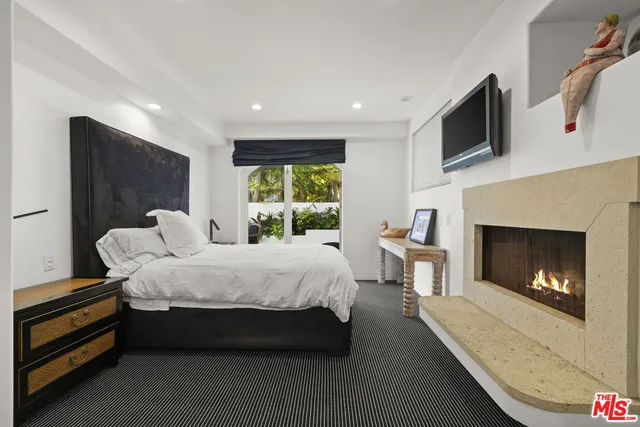 a bathroom with a bathtub sink and mirror