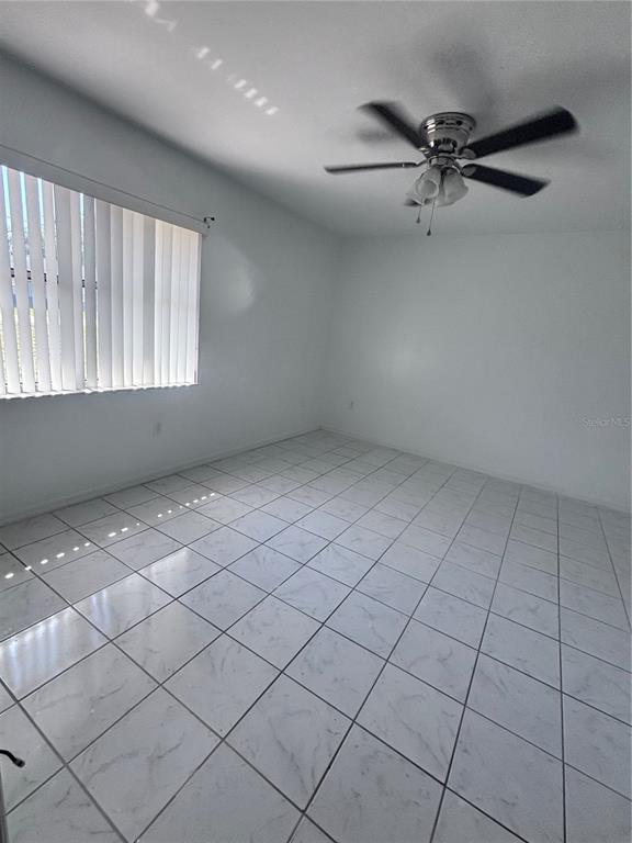 11806 Southeast 72nd Terrace Road Belleview, FL 34420 - Photo 8 of 13 a view of an empty room and window