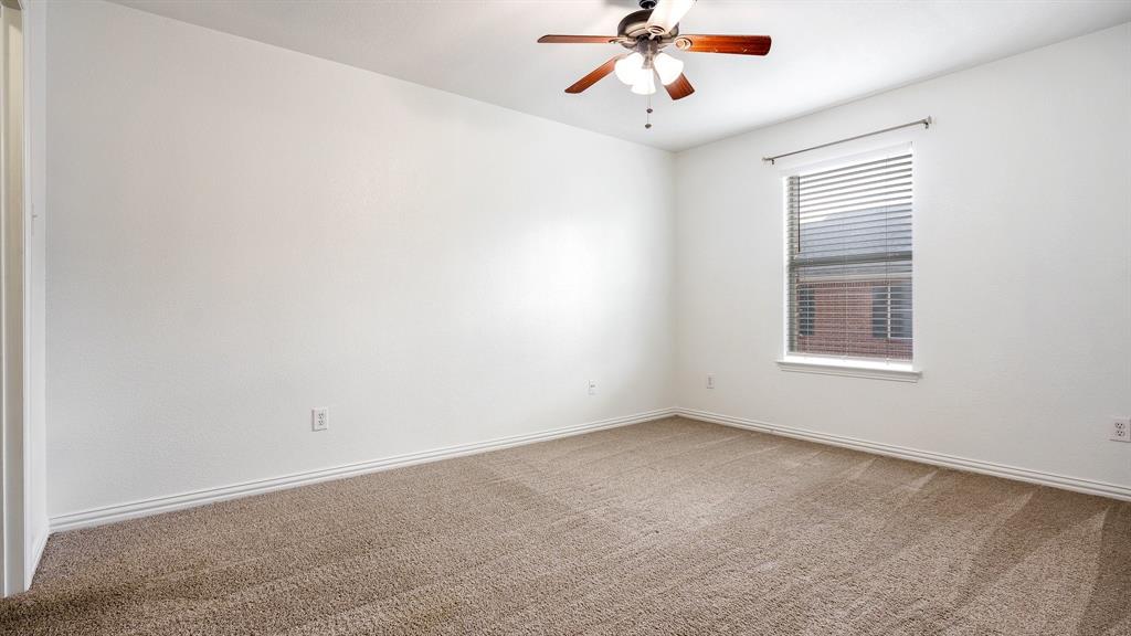 3206 Bedford Road Bedford, TX 76021 - Photo 16 of 26 a view of a room with a ceiling fan and window