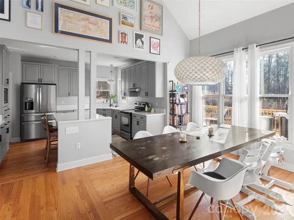 a kitchen with kitchen island a sink stainless steel appliances and cabinets