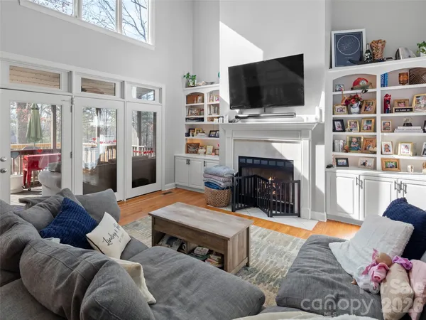 a living room with furniture and a book shelf
