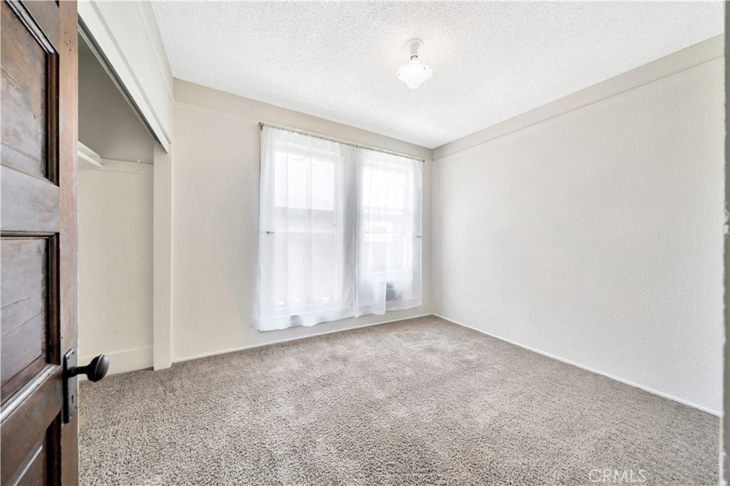 339 South Orange Street Orange, CA 92866 - Photo 15 of 52 an empty room with windows