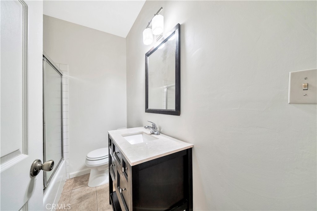 339 South Orange Street Orange, CA 92866 - Photo 17 of 52 a bathroom with a sink and a mirror