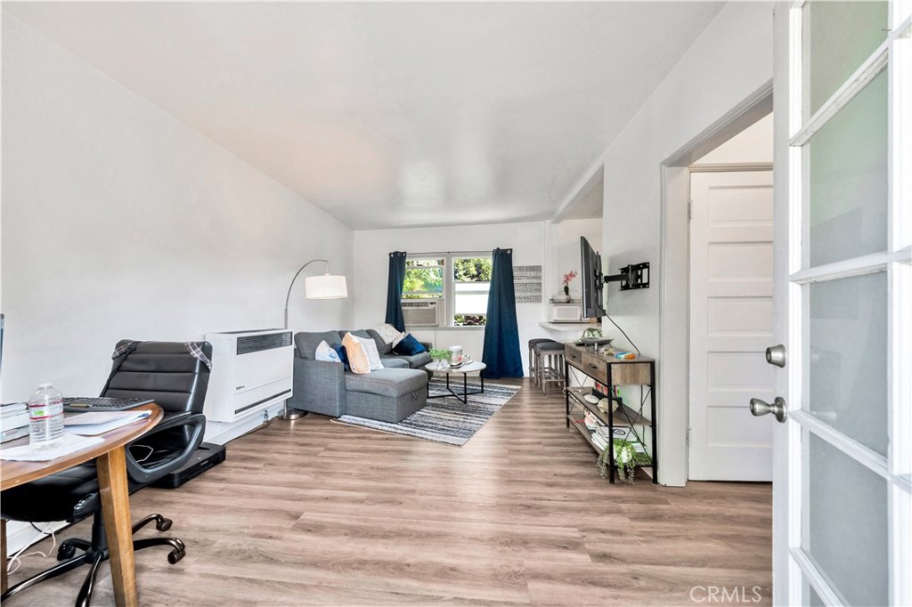 339 South Orange Street Orange, CA 92866 - Photo 31 of 52 a living room with furniture and a wooden floor