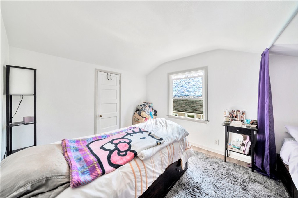 339 South Orange Street Orange, CA 92866 - Photo 38 of 52 a bedroom with a bed and a table in it with window