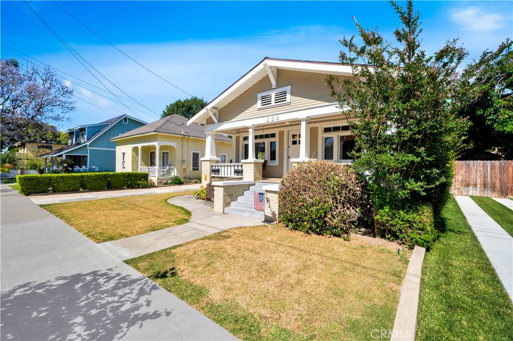 339 South Orange Street Orange, CA 92866 - Photo 5 of 52 a front view of a house with a yard