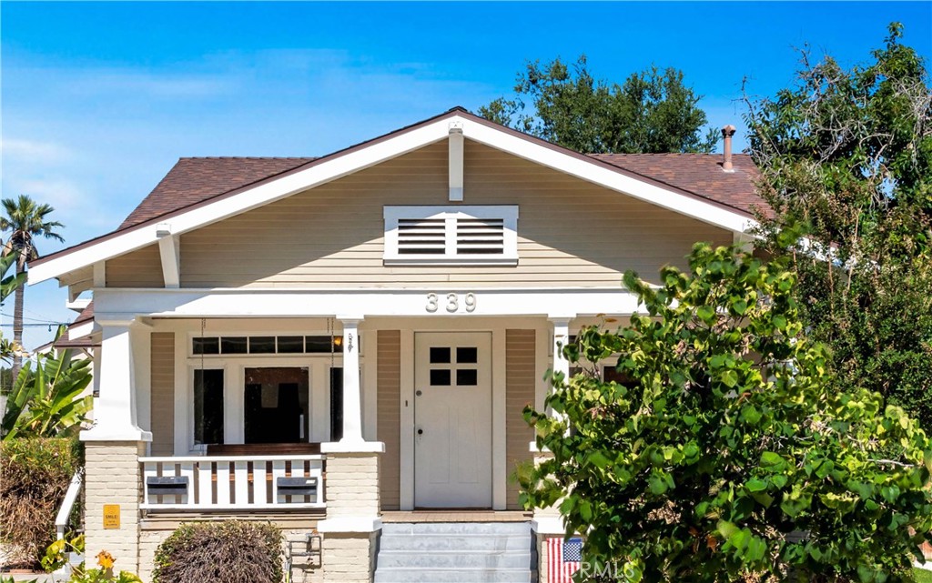 339 South Orange Street Orange, CA 92866 - Photo 8 of 52 a front view of a house with a yard