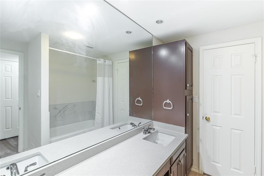 12680 Hillcrest Road, Unit 4101 Dallas, TX 75230 - Photo 18 of 37 Dual vanity with integrated sinks and chrome fixtures