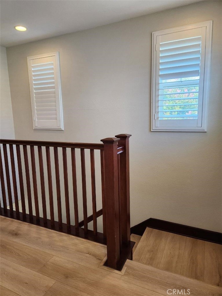 146 Violet Bloom Irvine, CA 92618 - Photo 16 of 25 a view of a black and white wooden floor