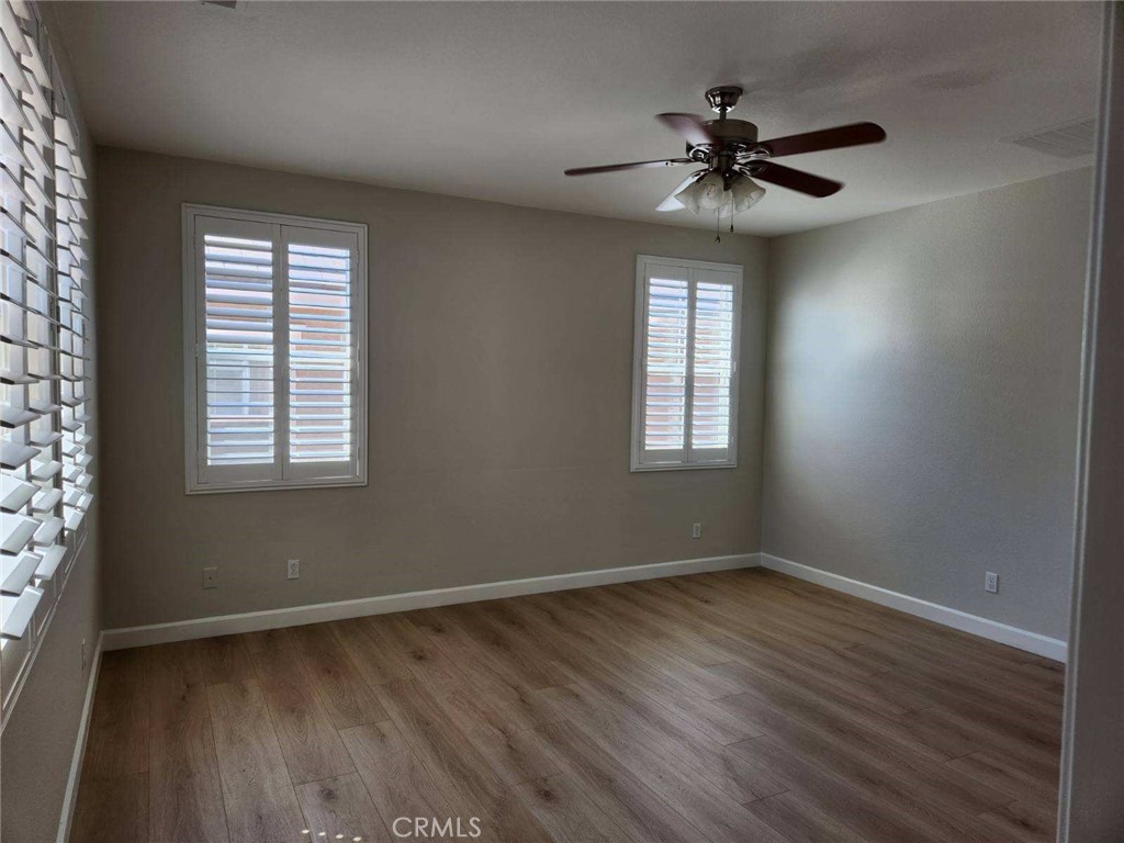 146 Violet Bloom Irvine, CA 92618 - Photo 20 of 25 wooden floor in an empty room with a window