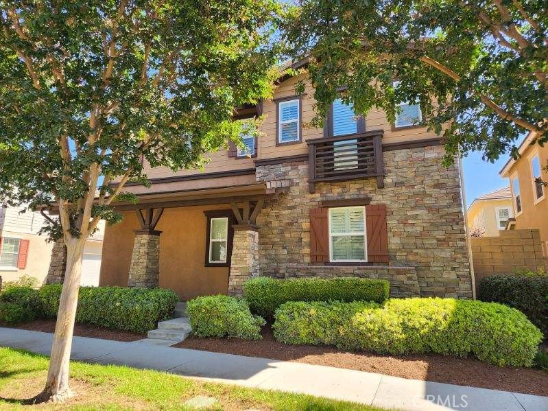 146 Violet Bloom Irvine, CA 92618 - Photo 25 of 25 front view of a house with a yard