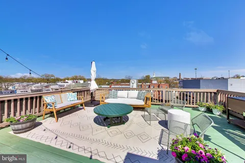 a view of a balcony with chairs