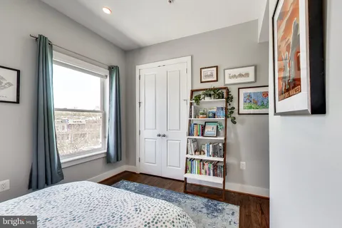 a bedroom with furniture and window