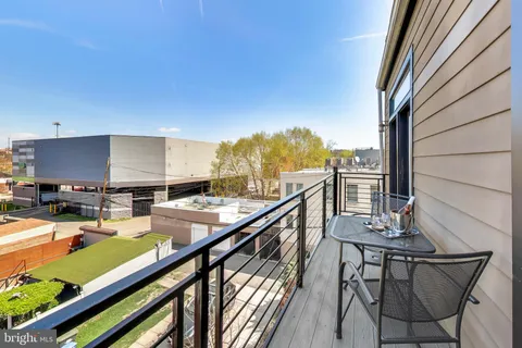 a view of a balcony with chairs