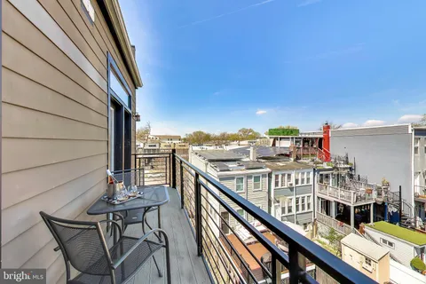 a view of a balcony with furniture
