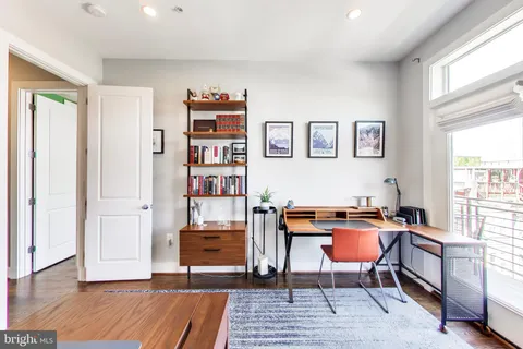 a view of a chairs on deck with wooden floor
