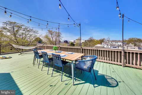 a view of a terrace with furniture