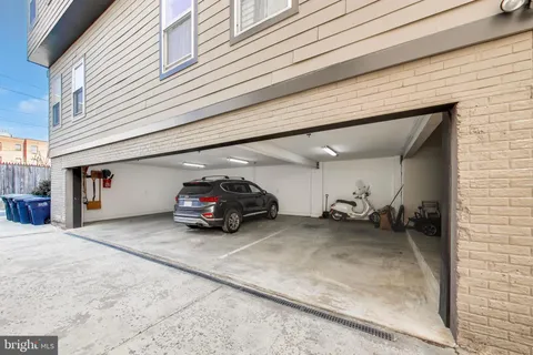 a front view of a building with a garden