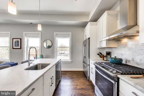 a kitchen with a stove and a sink