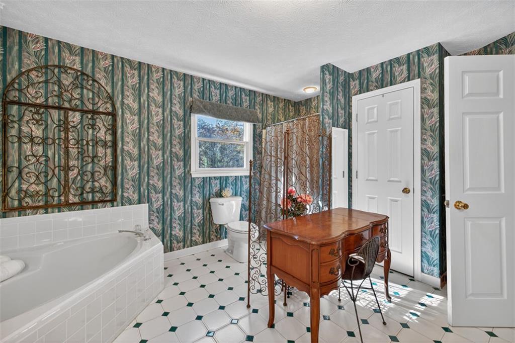 2150 Oglesby Bridge Road Southwest Conyers, GA 30094 - Photo 42 of 113 a living room with furniture and a painting on the wall