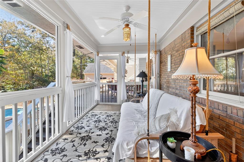2150 Oglesby Bridge Road Southwest Conyers, GA 30094 - Photo 55 of 113 a view of a dining room with furniture window and wooden floor