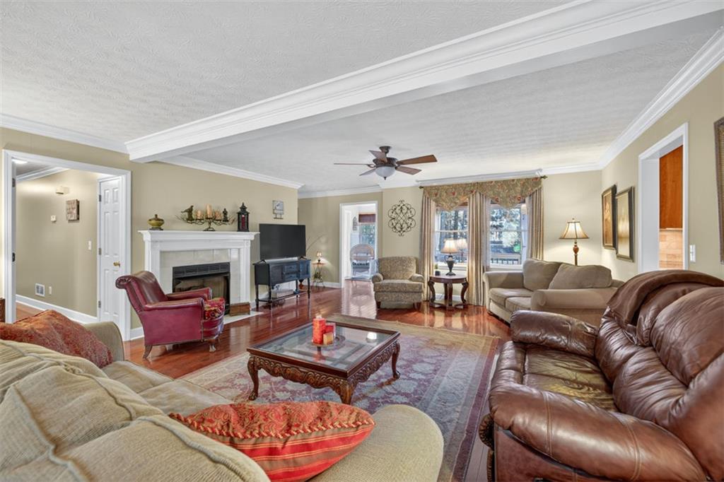 2150 Oglesby Bridge Road Southwest Conyers, GA 30094 - Photo 6 of 113 a living room with furniture fireplace and a large window