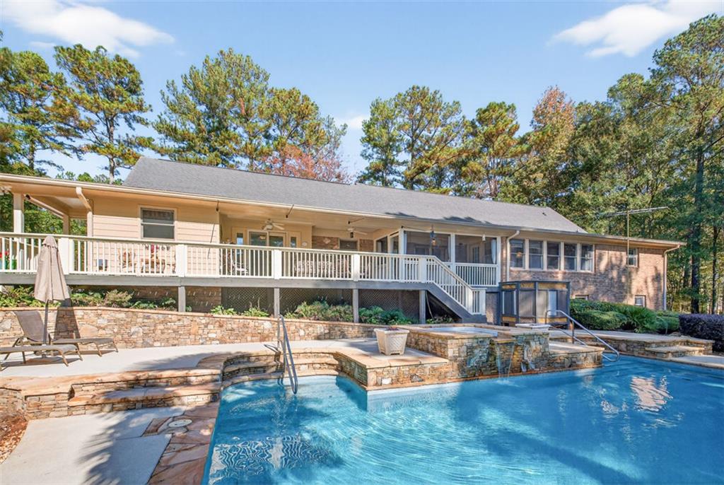 2150 Oglesby Bridge Road Southwest Conyers, GA 30094 - Photo 64 of 113 a front view of a house with swimming pool having outdoor seating
