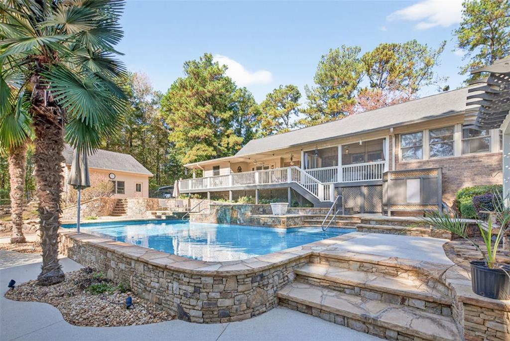 2150 Oglesby Bridge Road Southwest Conyers, GA 30094 - Photo 70 of 113 a view of a house with backyard and sitting area