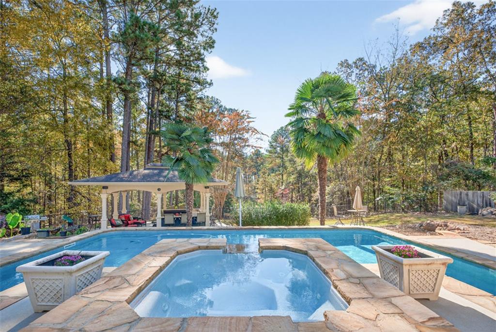 2150 Oglesby Bridge Road Southwest Conyers, GA 30094 - Photo 73 of 113 a view of a house with swimming pool