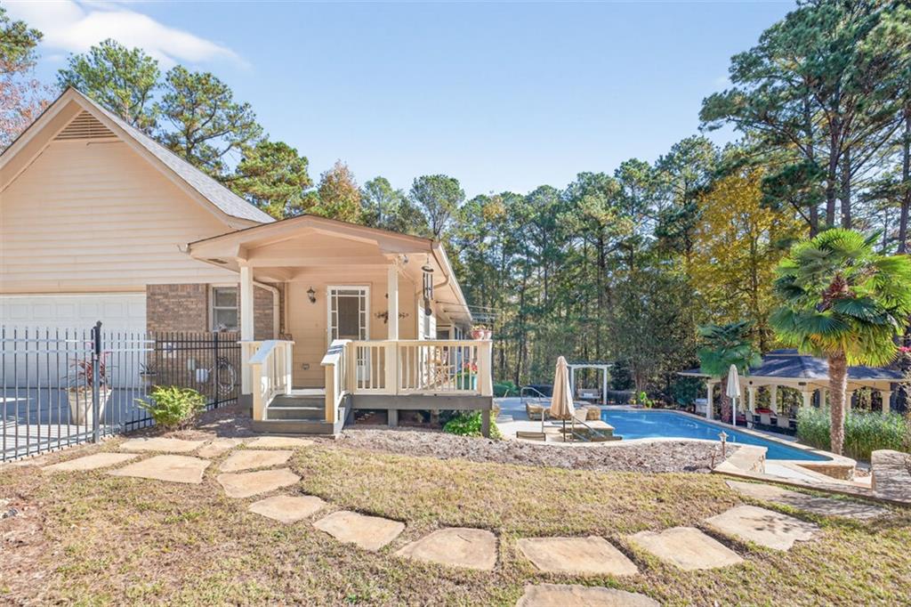 2150 Oglesby Bridge Road Southwest Conyers, GA 30094 - Photo 81 of 113 a front view of a house with a yard