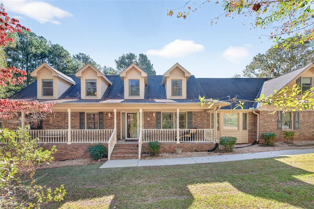 2150 Oglesby Bridge Road Southwest Conyers, GA 30094 - Photo 84 of 113 front view of a house with a yard