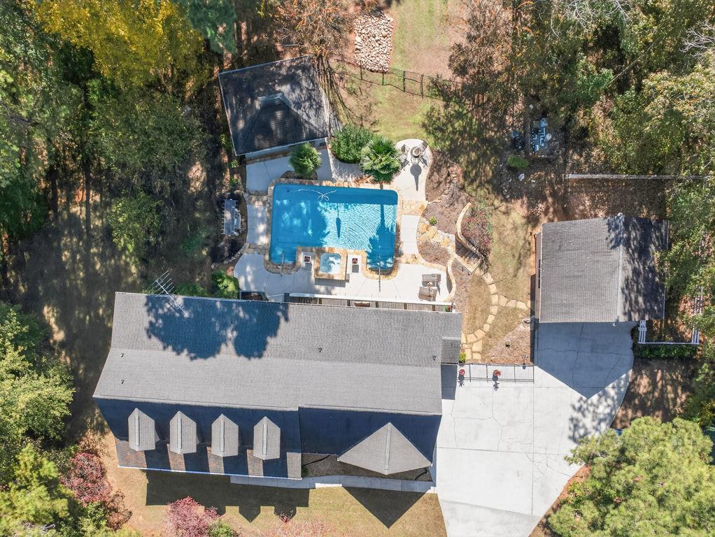 2150 Oglesby Bridge Road Southwest Conyers, GA 30094 - Photo 97 of 113 a view of a house with backyard and sitting area