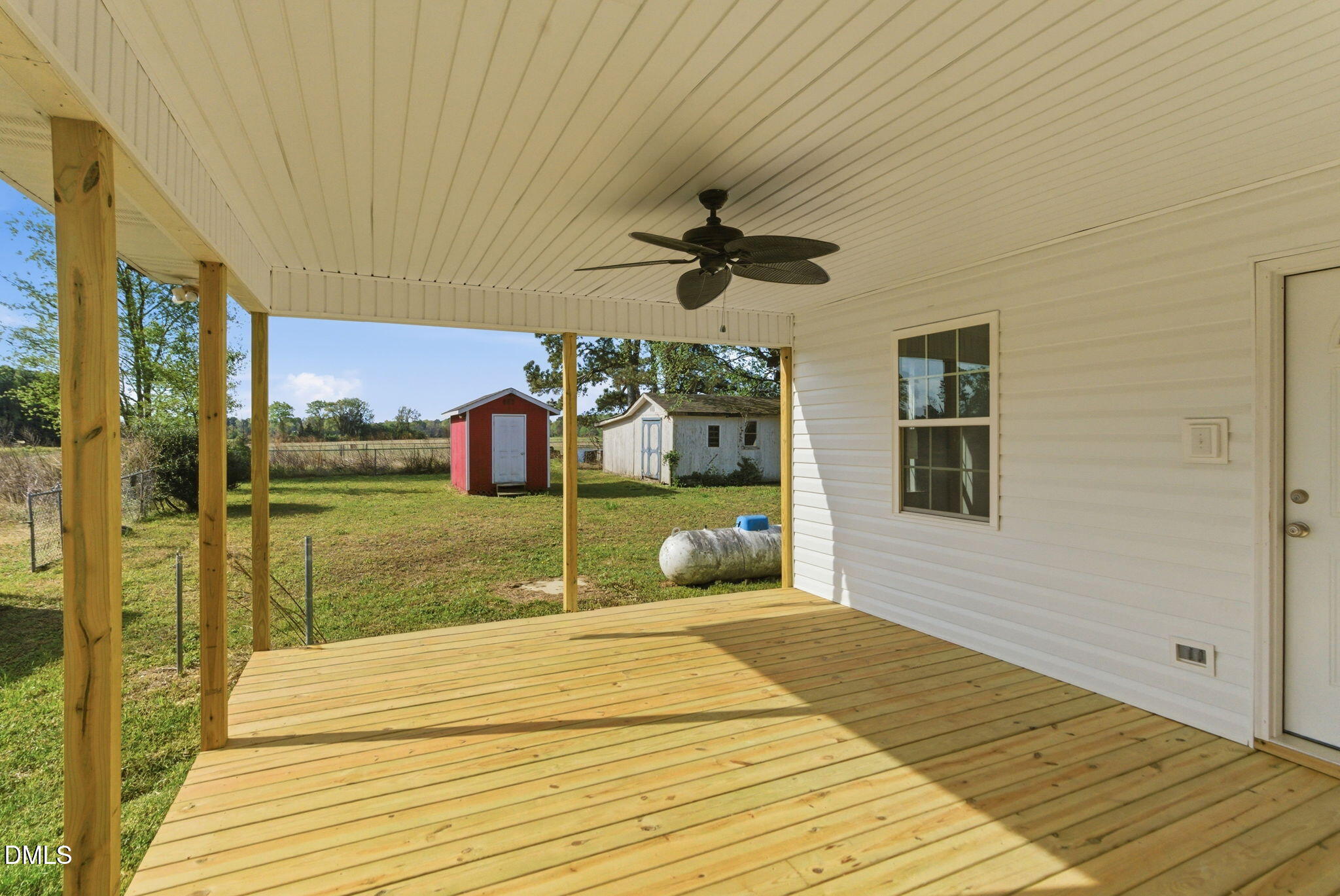 945 Old School Road Four Oaks, NC 27524 - Photo 7 of 37 a bedroom with a bed and a chandelier