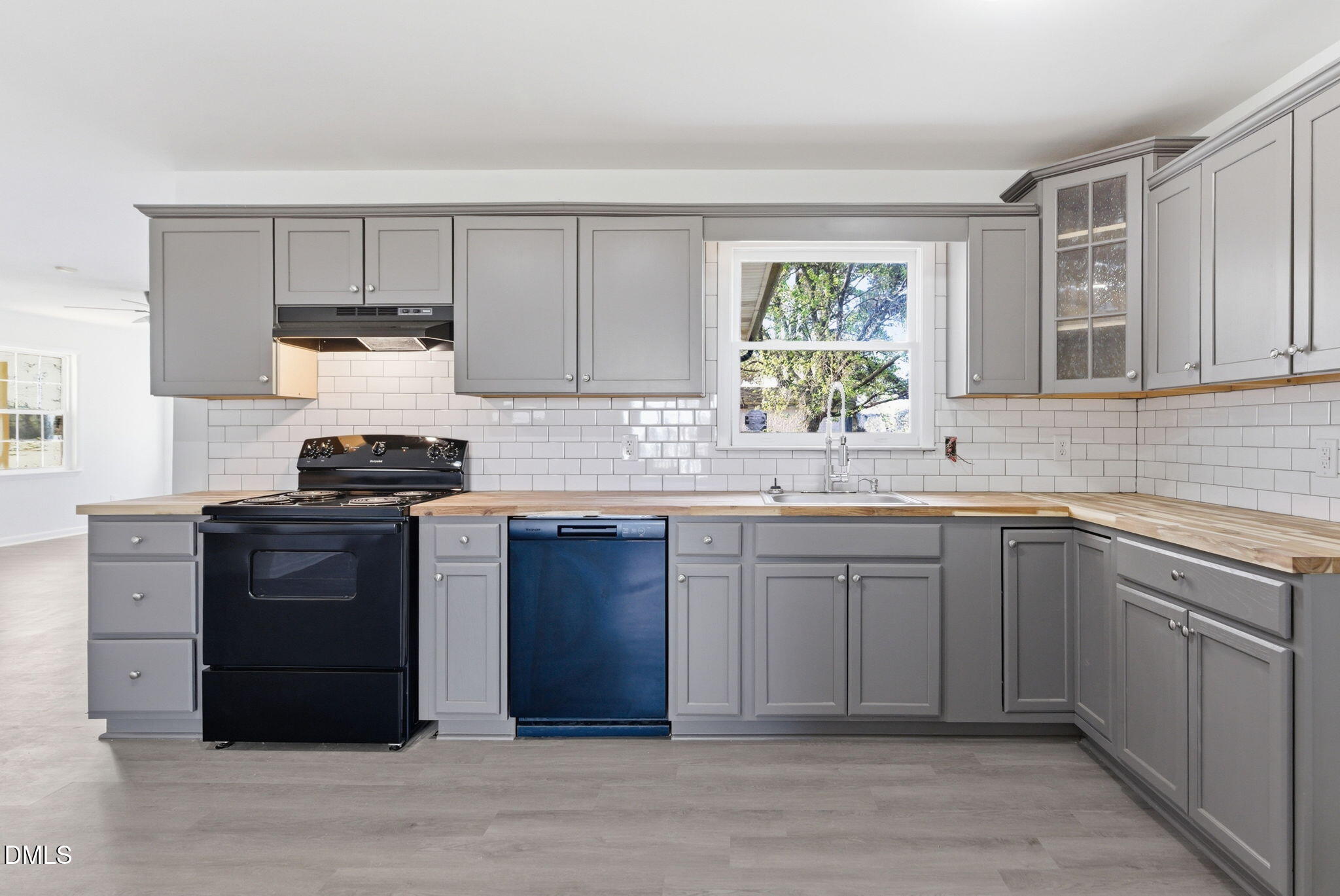 945 Old School Road Four Oaks, NC 27524 - Photo 8 of 37 a kitchen with stainless steel appliances granite countertop a stove a sink and a microwave
