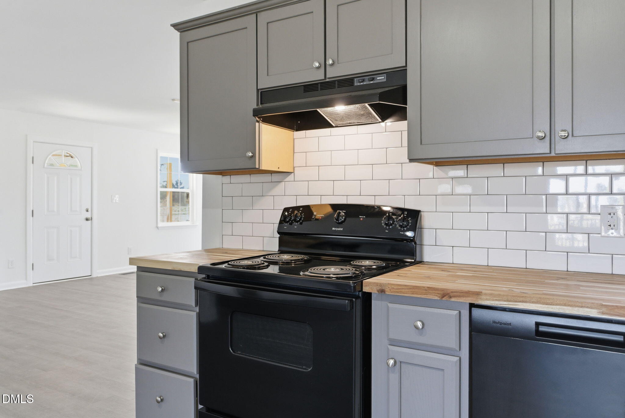 945 Old School Road Four Oaks, NC 27524 - Photo 10 of 37 a kitchen with a stove and a microwave