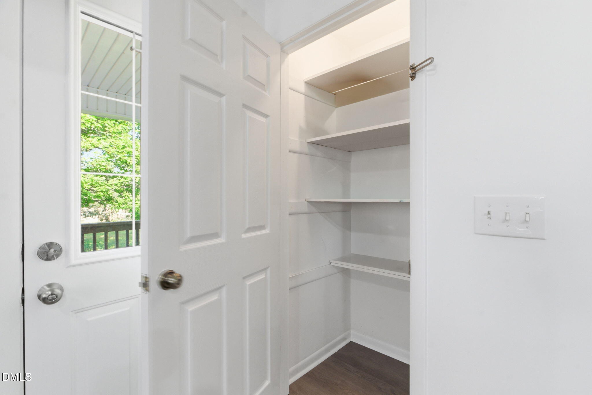 945 Old School Road Four Oaks, NC 27524 - Photo 13 of 37 a view of a room with rack on the wall