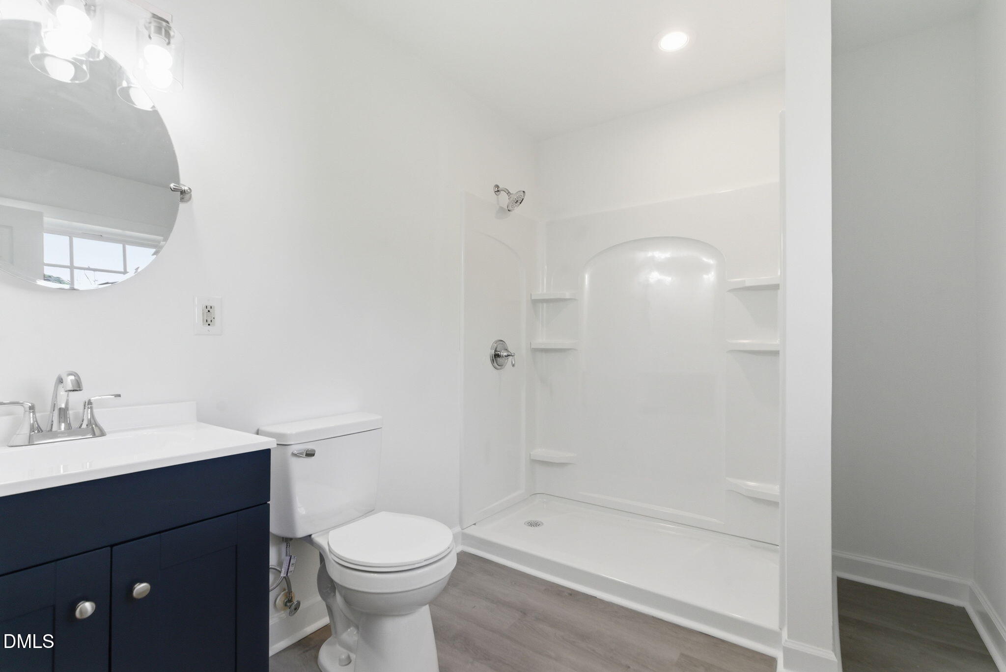 945 Old School Road Four Oaks, NC 27524 - Photo 17 of 37 a bathroom with a sink a toilet and shower