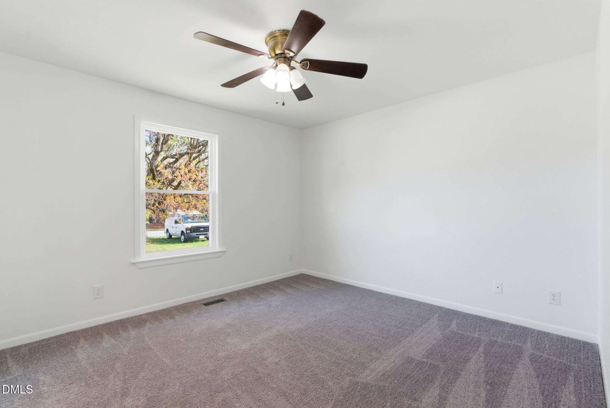 945 Old School Road Four Oaks, NC 27524 - Photo 20 of 37 an empty room with a window