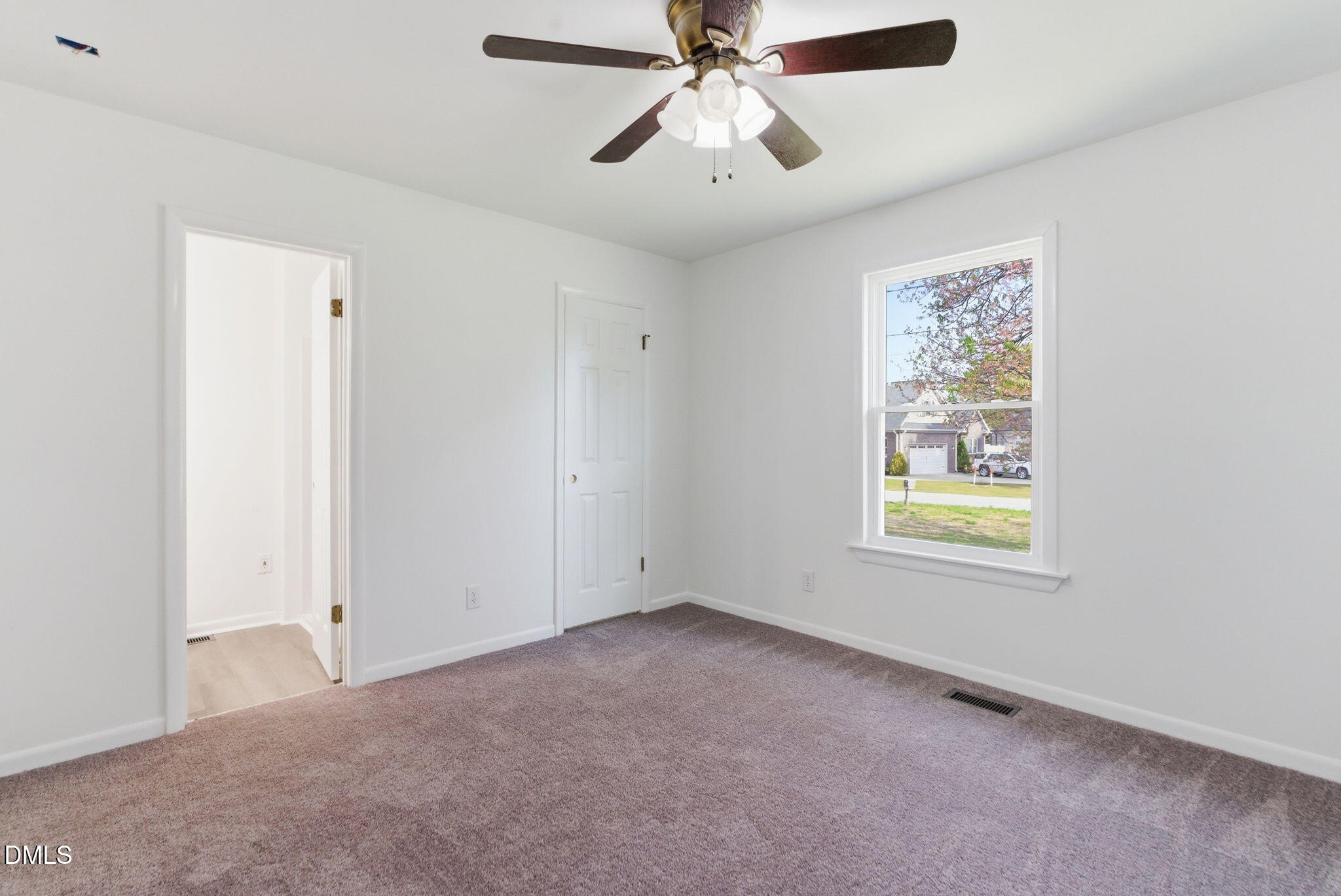 945 Old School Road Four Oaks, NC 27524 - Photo 21 of 37 a view of an empty room with a window