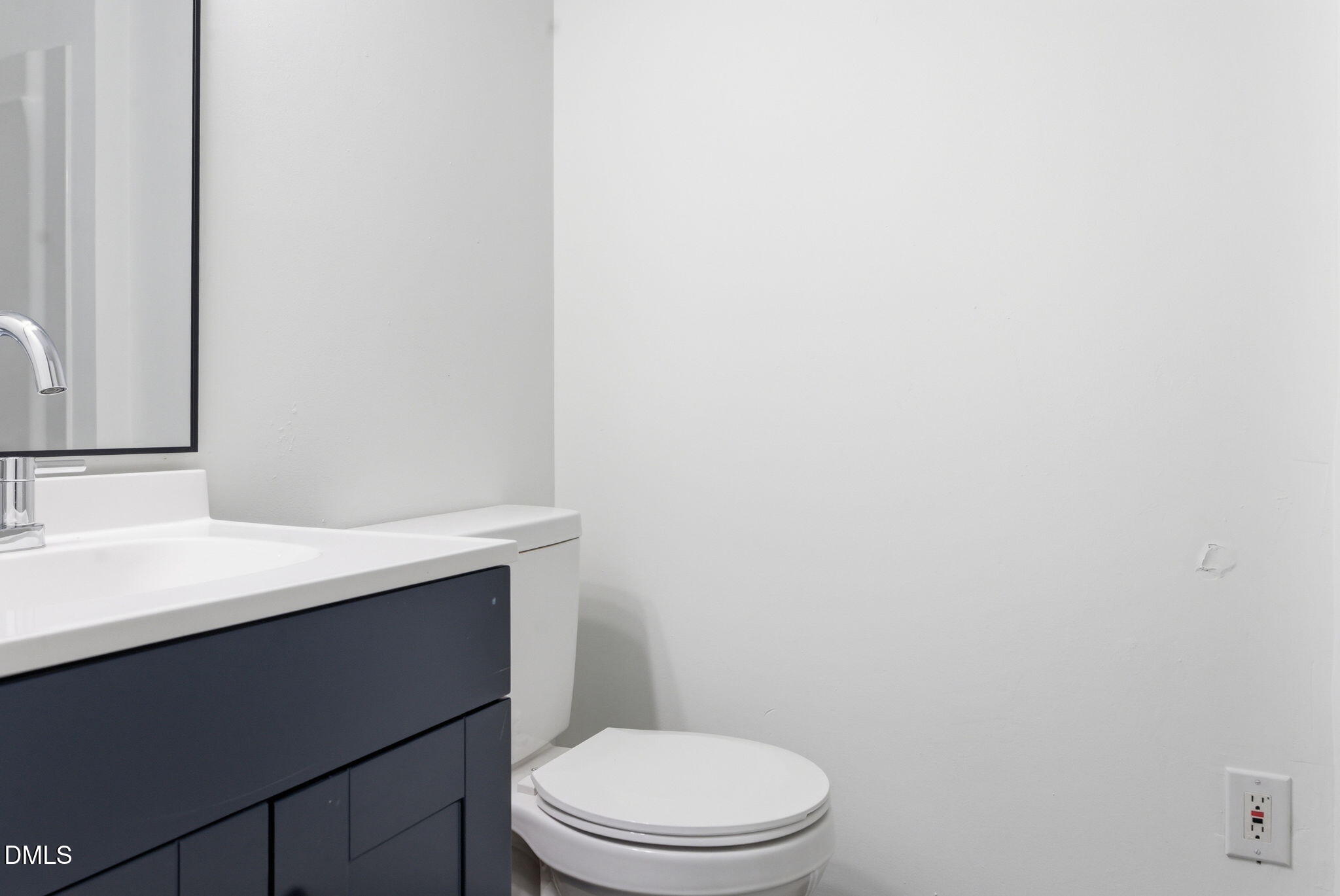 945 Old School Road Four Oaks, NC 27524 - Photo 22 of 37 a white toilet sitting next to a white sink