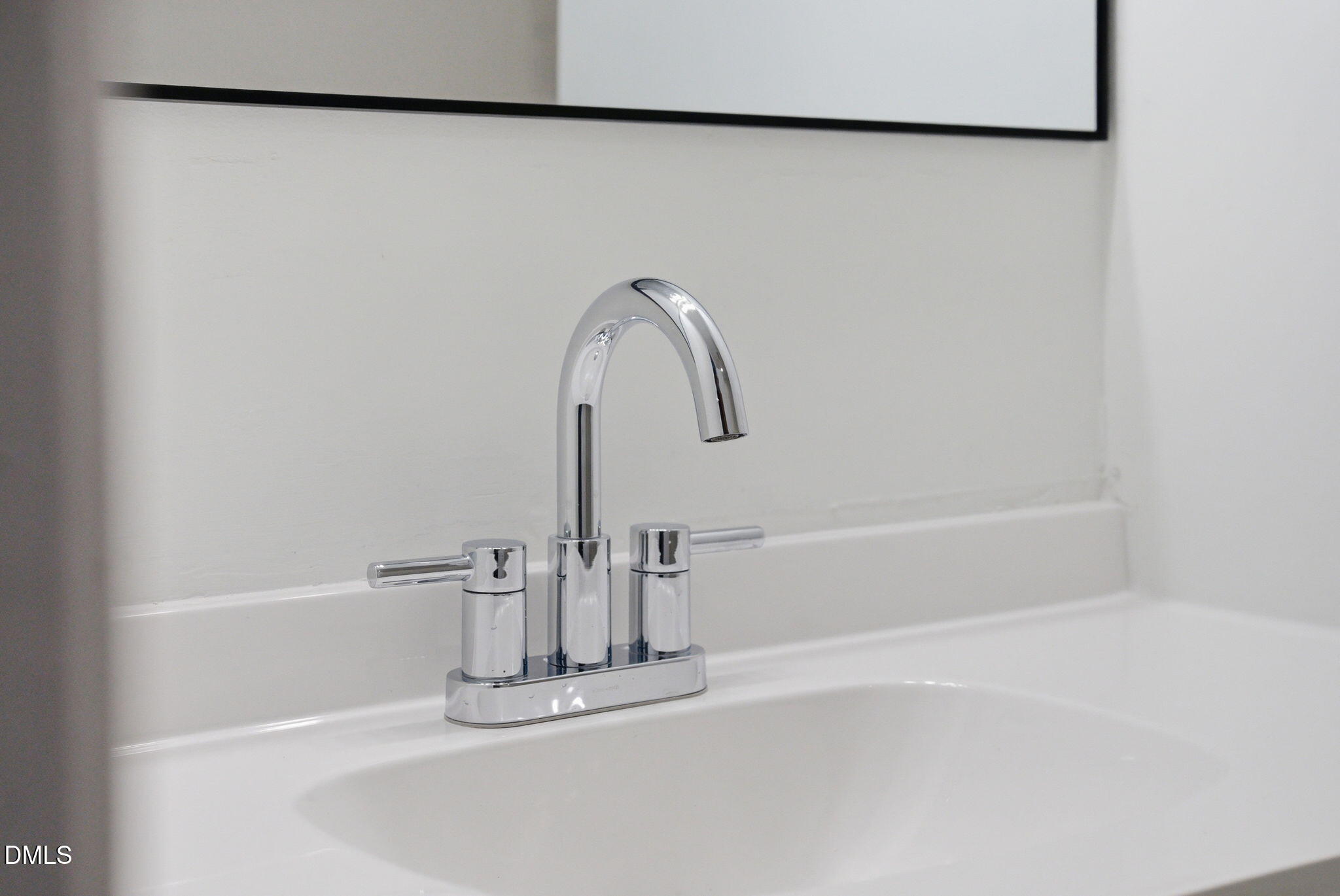 945 Old School Road Four Oaks, NC 27524 - Photo 23 of 37 a close view of a faucet in a white house and blue roof deck